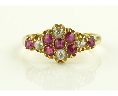 A Victorian 18ct gold 11 stone ruby and diamond set ring, setting height 9.6mm, size R.