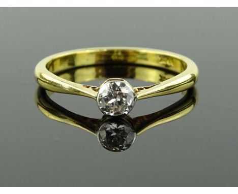 An 18ct gold solitaire diamond ring, in rub-over setting, diamond approx. 0.2cts, size M.