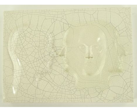 Glenys Barton (born 1944), a glazed ceramic relief plaque, four faces, signed on reverse, dated 1981, no. 5/10, width 32cm.
