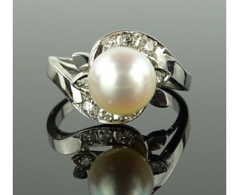 An 18ct white gold whole Akoya pearl set ring, with diamond set shoulders, pearl diameter 8mm, size M.
