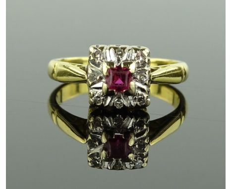 An 18ct gold princess-cut ruby and diamond cluster panel ring, with pierced gallery, setting height 7.8mm, size L.