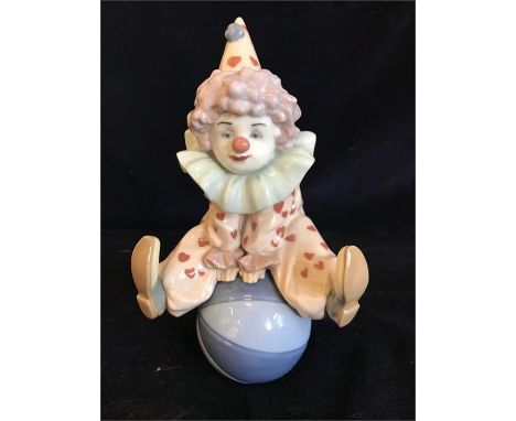 A Lladro figure of a clown on a ball