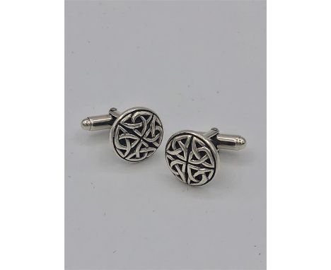 A pair of silver Celtic cufflinks