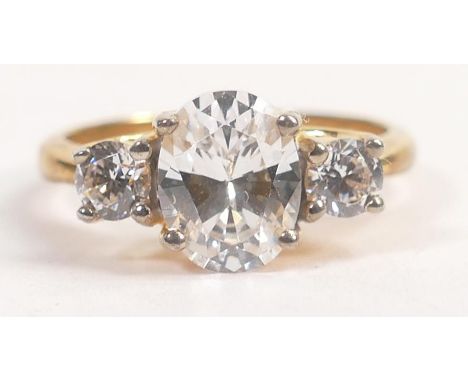 Tru Diamonds 3 stone trilogy ring with center stone measuring  9mm x 7mm ring size Q,   with unknown metal setting.  High qua