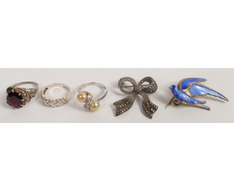 A collection of Silver jewellery including enamel bluebird brooch, marcasite ribbon brooch and 3 Silver rings. (5) 