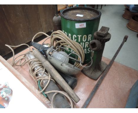 A selection of Grease guns, tin of tractor grease, inspection lamps and early car jack.