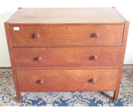 20th century Heals style oak chest of three long drawers with turned wooden handles, W92cm D48cm H76cm: See Mallams Oxford lo