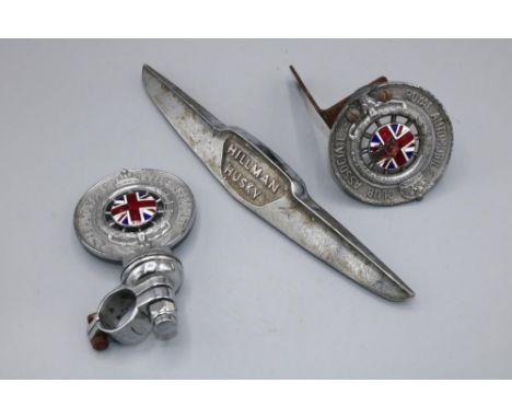 Two vintage RAC Royal Automobile Club Associate car badges, incl. one marked F37174; and a front badge from a Hillman Husky (