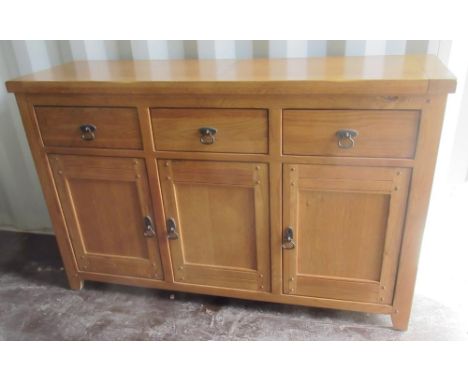Contemporary oak side cabinet, three drawers above three doors, W140cm D43cm H87cm 