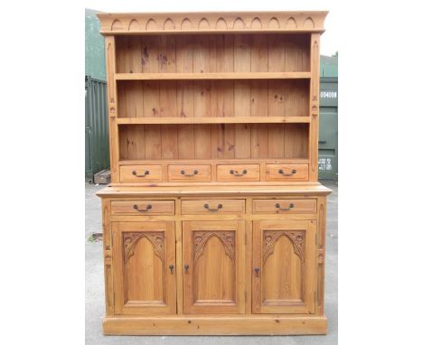 20th century pine Gothic design dresser, open shelves over four drawers, over three drawers and three cupboards, W153cm D49cm