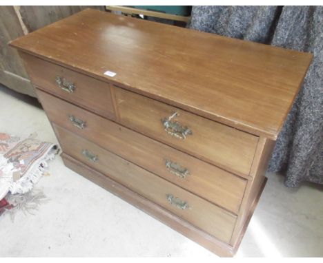 Edwardian walnut chest of two short and two long drawers with brass handles, on skited base, W108 D46cm H78cm 