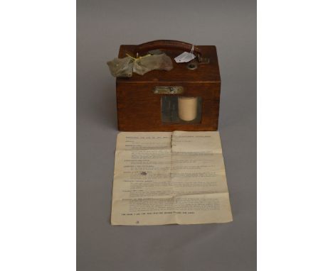 A wooden cased Alfred Plasschaert Pigeon-Timer with instructions, keys etc