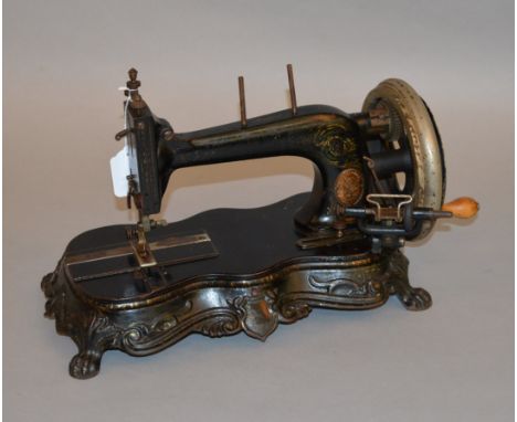 A 19th century Junker & Ruh. Karlsruhe, Baden sewing machine on cast iron base and paw feet.