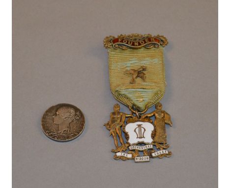 A hallmarked silver gilt and enamel Masonic jewel for The Orchestral Lodge No. 3028 together with an 1897 silver Queen Victor