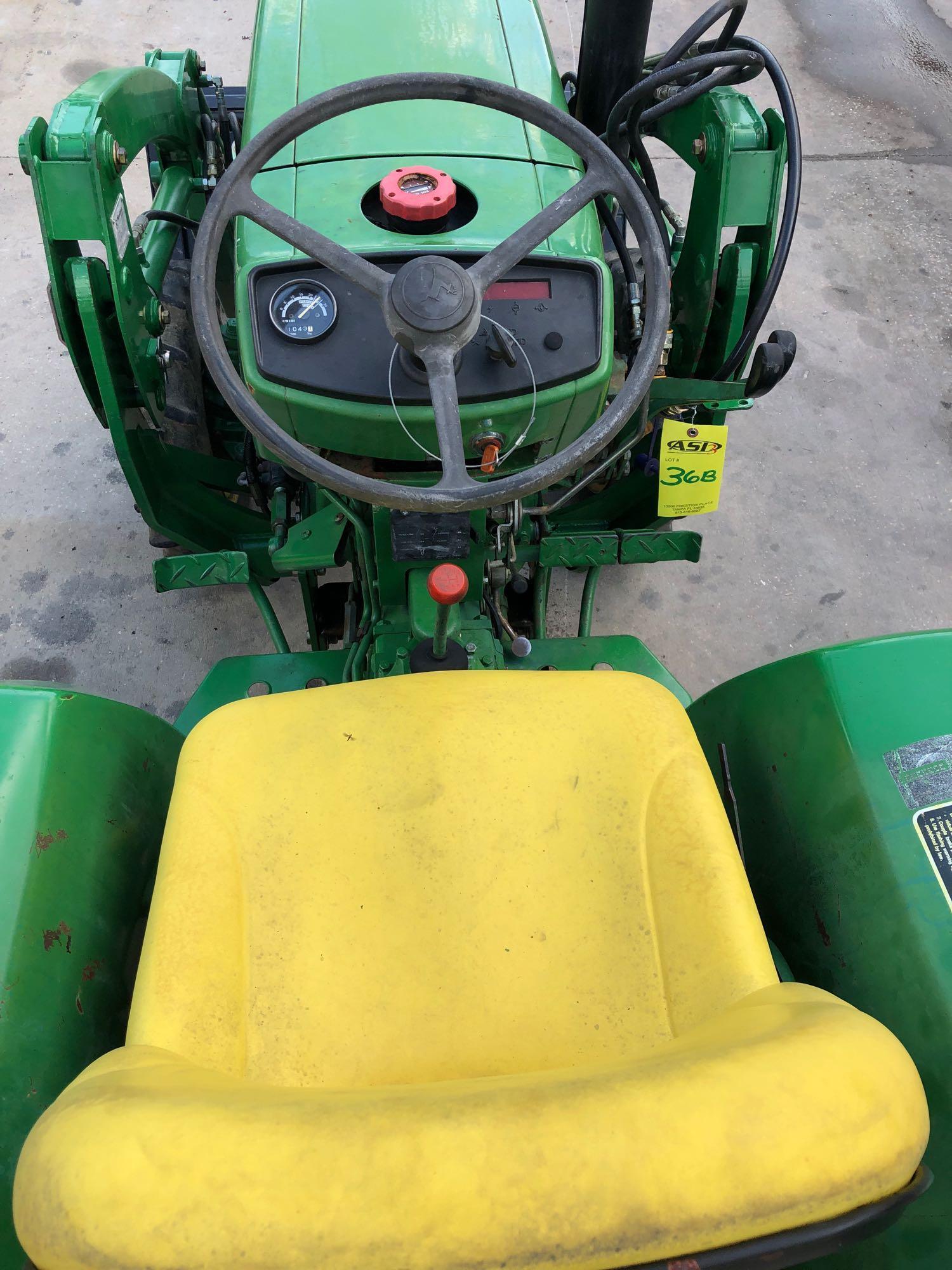 JOHN DEERE 750 TRACTOR WITH BUCKET ATTACHMENT, 1,042 HOURS SHOWING