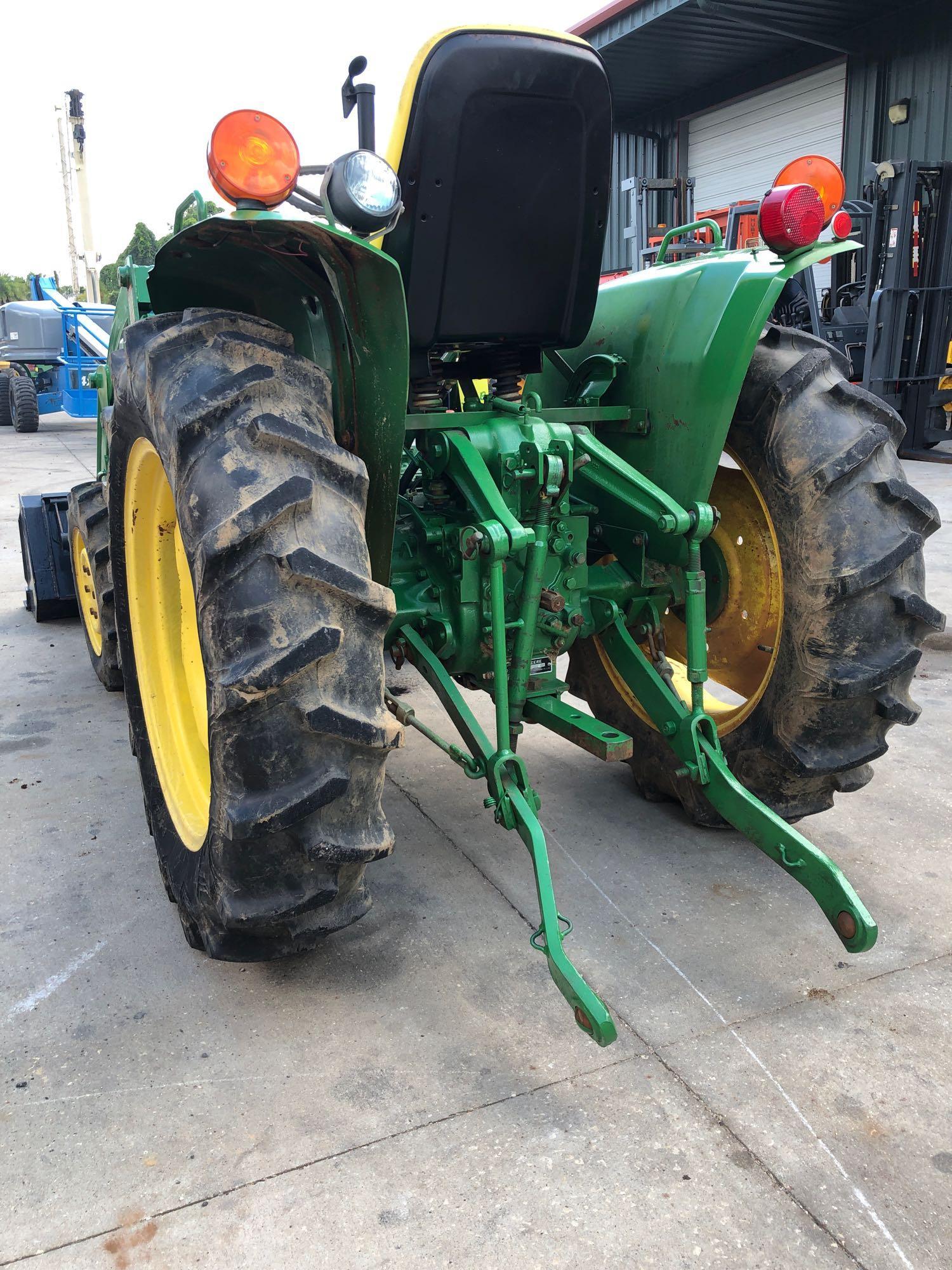 JOHN DEERE 750 TRACTOR WITH BUCKET ATTACHMENT, 1,042 HOURS SHOWING