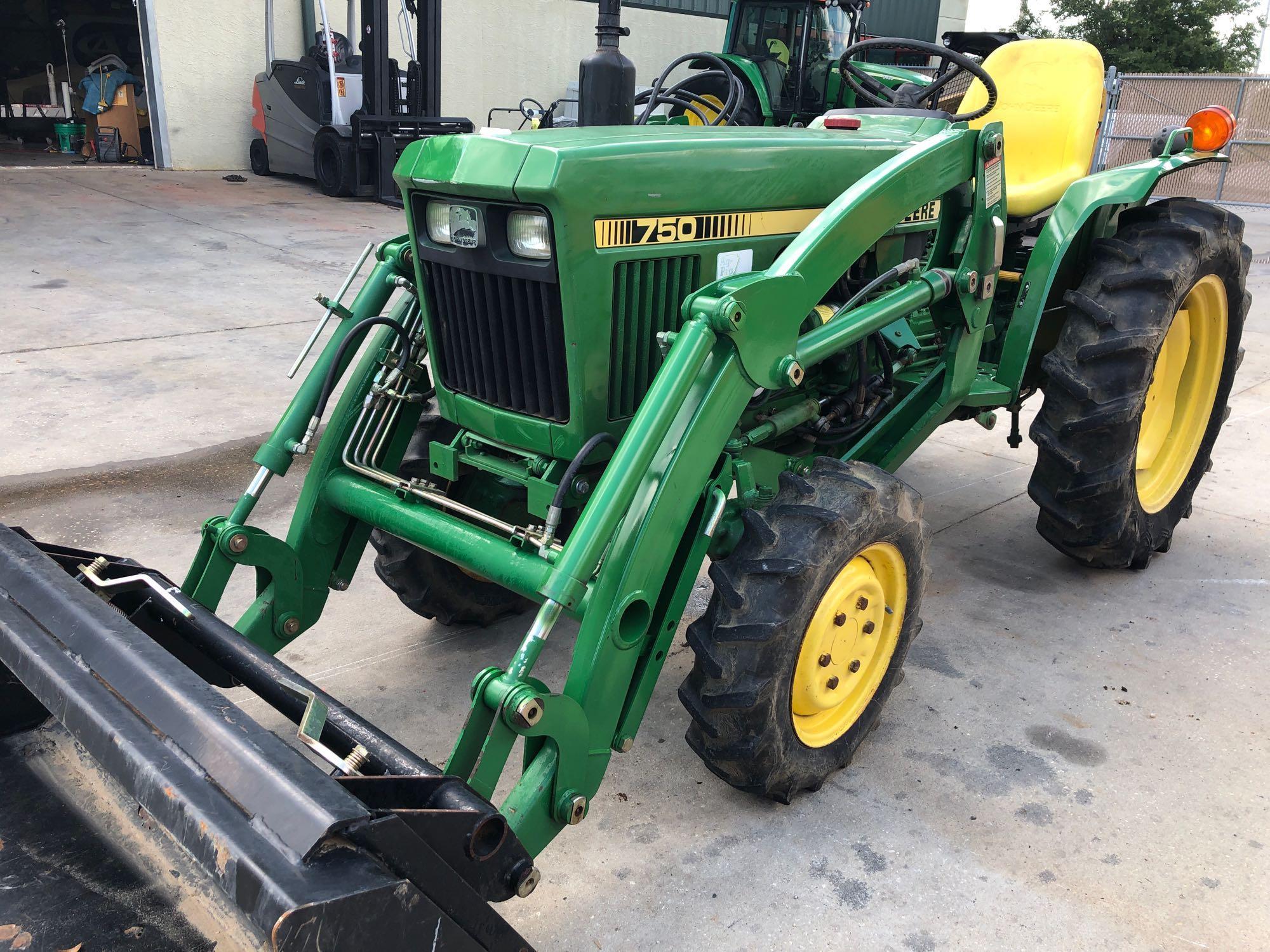JOHN DEERE 750 TRACTOR WITH BUCKET ATTACHMENT, 1,042 HOURS SHOWING