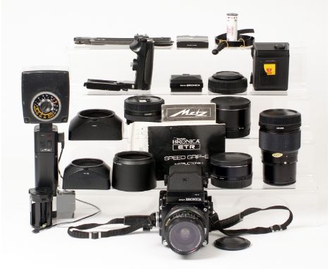 Extensive Bronica ETRS Outfit. To include ETRS body with standard 75mm lens, WLF, 2 roll film backs, AE-II prism finder, pist