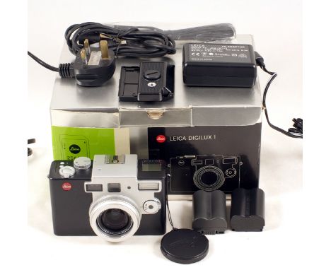 Leica Digilux 1 Compact Digital Camera. #2813686. (working, condition 4E). With leads, charger, two original and one after-ma