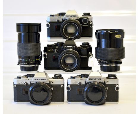 Olympus OM10 Cameras &amp; Lenses. To include black OM10 body and two chrome OM10 bodies (one with manual adapter, each with 