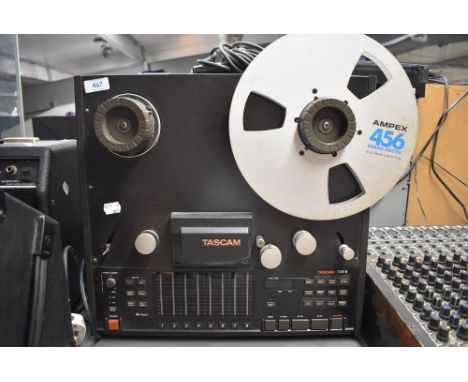 A Tascam TSR-8 8 channel reel to reel recorder and a Tascam RC-408 remote control