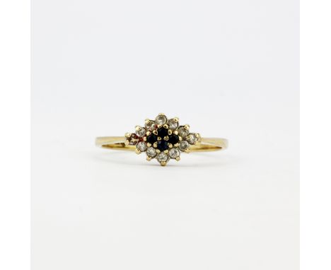 A hallmarked 9ct yellow gold diamond and sapphire set ring, (P.5).