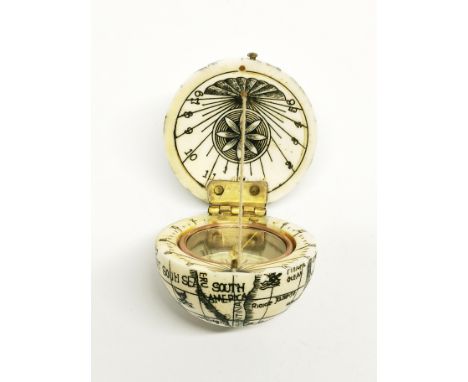 A miniature bone globe compass, Dia. 4cm.