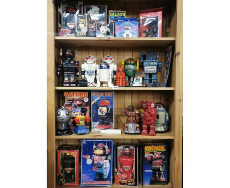 A large collection of robot figures, some boxed.