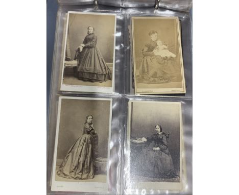 Two albums of Victorian portrait photographs.