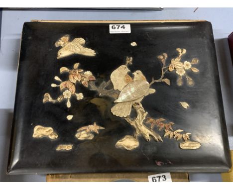 A Japanese bone and mother of pearl decorated album of postcards.