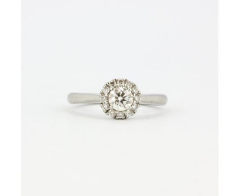 An 18ct white gold and platinum halo ring set with brilliant cut diamonds, approx. 0.34ct total, clarity VS1, colour G, (J.5)