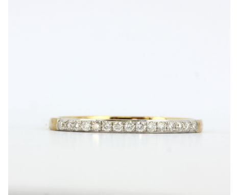 A hallmarked 9ct yellow gold half eternity ring set with brilliant cut diamonds, (Q.5).