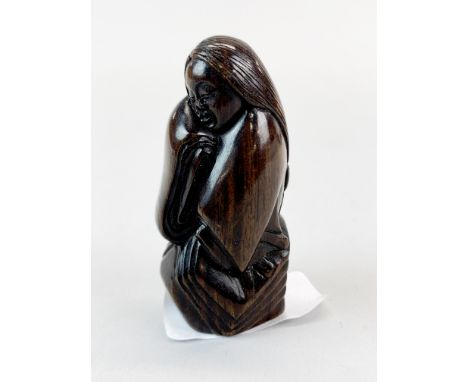 A quality carved fruitwood Netsuke of a Japanese lady with long hair wearing a kimono, with inlaid signature.