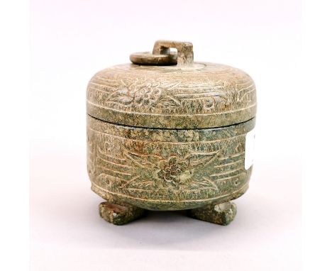 A Chinese carved jade / hardstone box and cover with integral ring handle, H. 10cm, Dia. 10cm.
