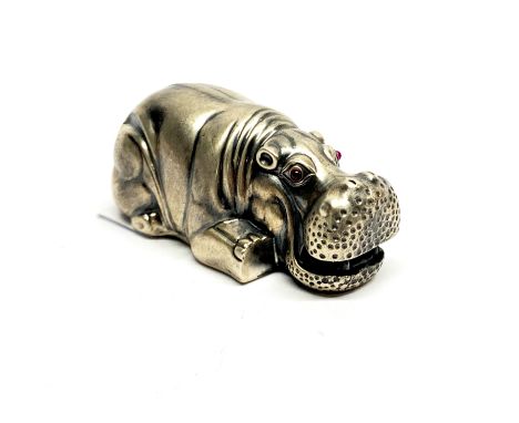 A Russian .88 silver model of a hippo with ruby eyes, 8 x 3.5cm.