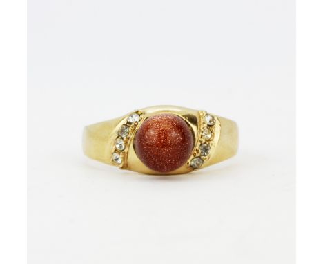 A yellow metal (tested minimum 9ct gold) goldstone set ring, (P).