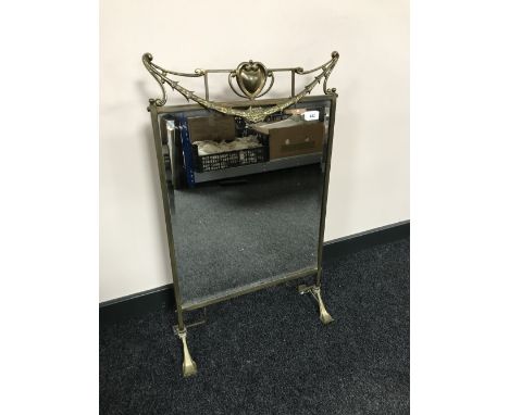 An early 20th century brass framed Art Nouveau mirrored fire screen 
