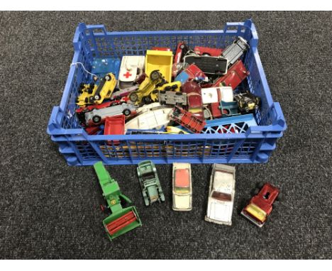 A crate containing mid twentieth century and later die cast and tin plate vehicles, including Dinky, Corgi, etc