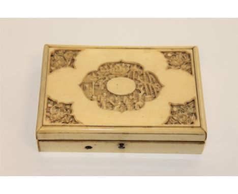 A 19th century Chinese ivory trinket box, the lid with a central cartouche carved in relief with villagers in a traditional s