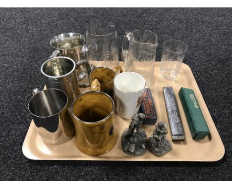 Two early twentieth century etched glass jugs together with a beaker, three harmonicas, two pewter Lord Of The Rings figurine