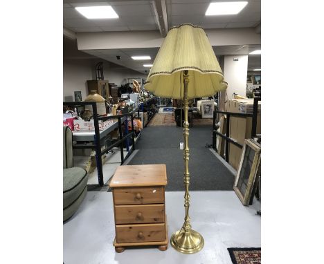 A pine bedside chest and a brass standard lamp with shade 