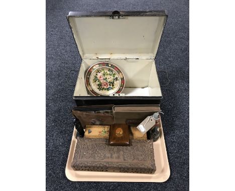 A tray containing a vintage tin box, black and white photograph albums, a carved trinket box, a wooden pencil case etc 