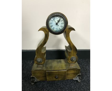 A contemporary French style mantel clock with battery movement