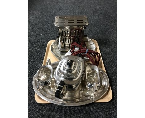 A tray containing a mid twentieth century Keith electric toaster together with a three piece Walker and Hall Sheffield plate 
