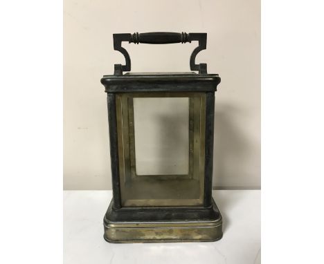 An antique brass carriage clock case