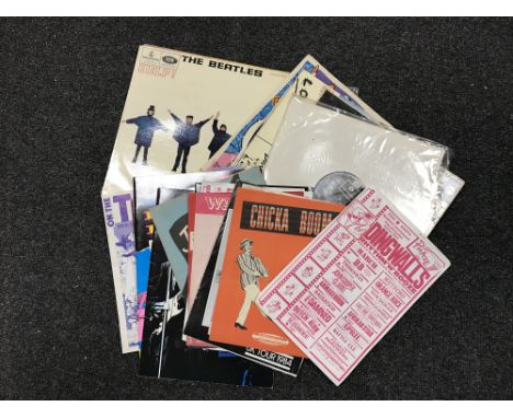 A crate containing a small quantity of LP's including Beatles, David Bowie, Rolling Stones, together with concert programmes 