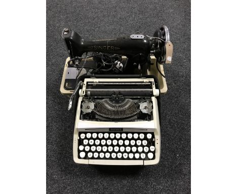 A cased Singer electric sewing machine, together with a cased Zephyr typewriter 