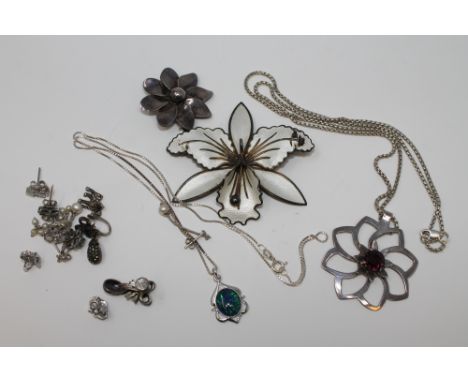 A collection of silver jewellery including a Norwegian enamel flower brooch