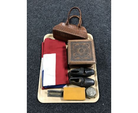 A tray containing a Union Jack flag, an early twentieth century metal desk stand, a boxed miniature woodworking plane, a carv
