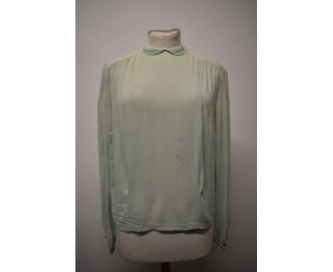 A mint green 1930s semi sheer blouse, having ladder work to collar and cuffs, medium size.